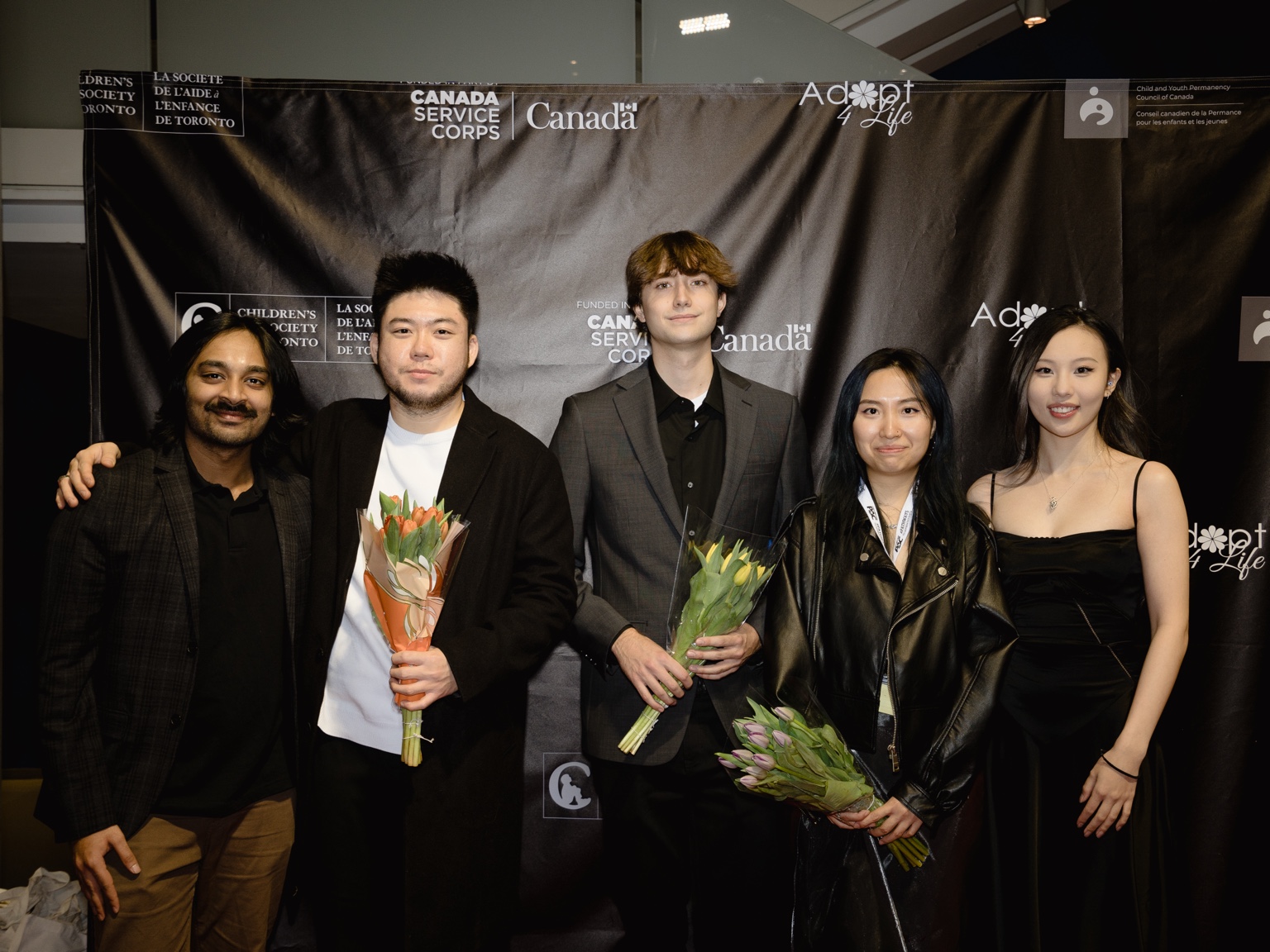 Five members of the project team posing at the premiere